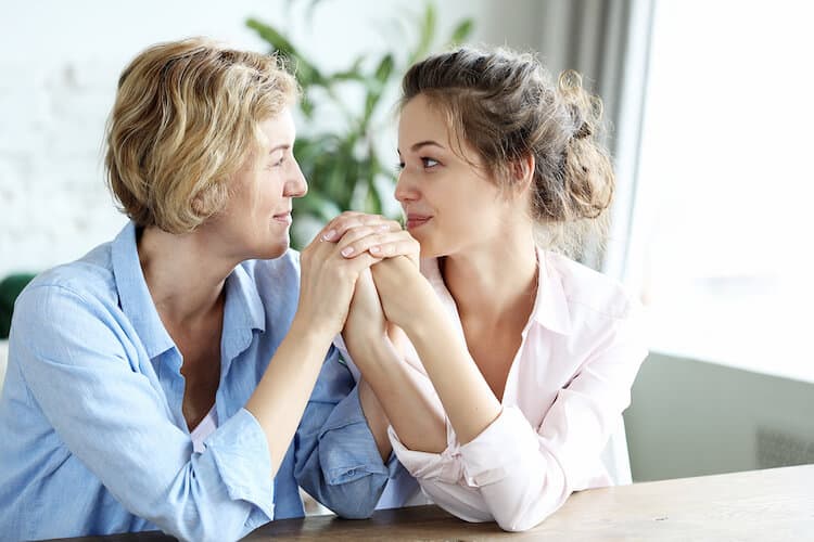 Adult child and parent discussion senior living options.