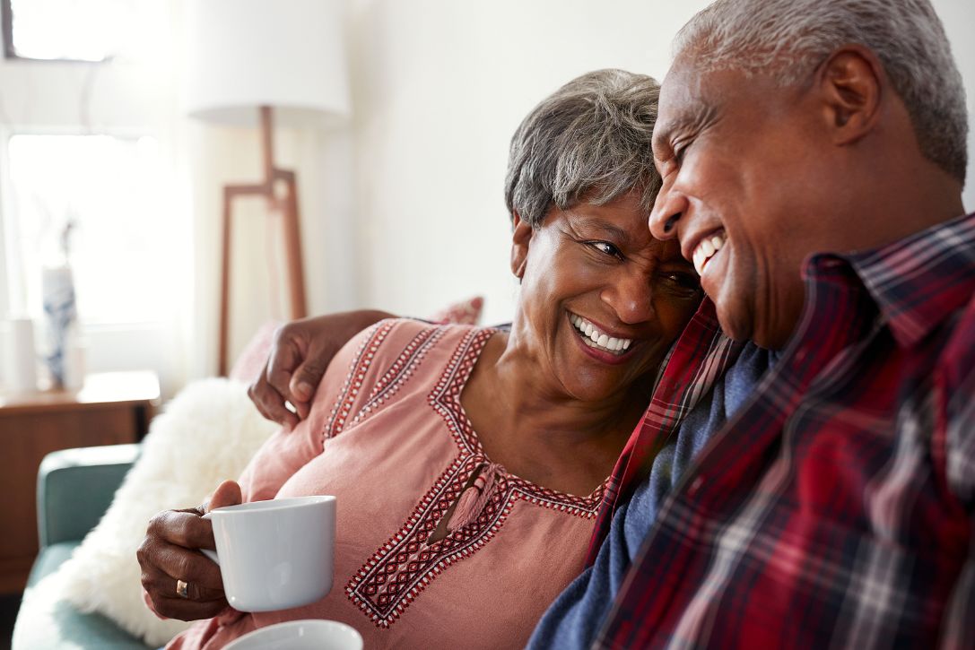 A relaxed senior couple enjoying a peaceful moment in the day.